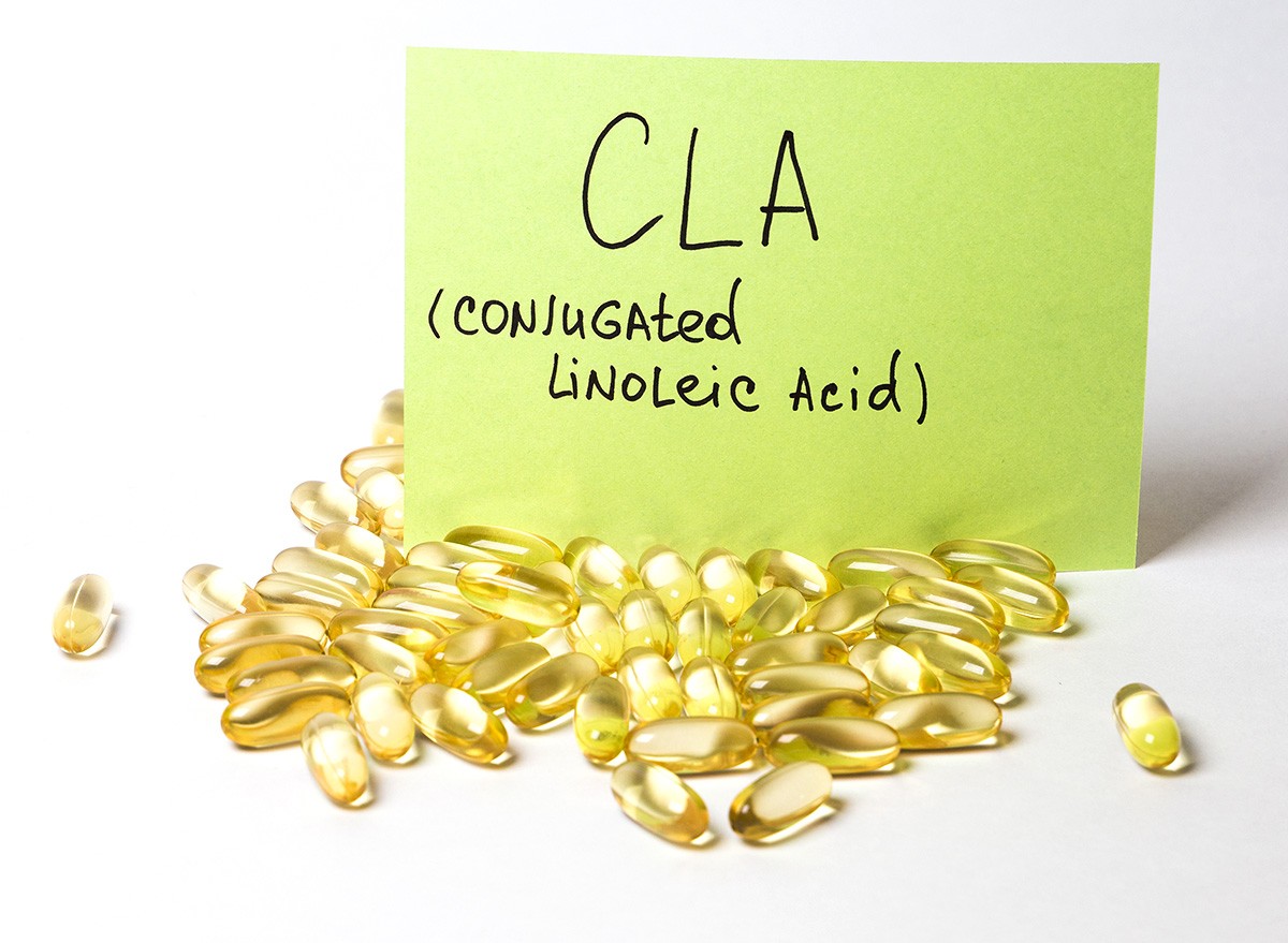Conjugated Linoleic Acid (CLA) supplements on a white surface