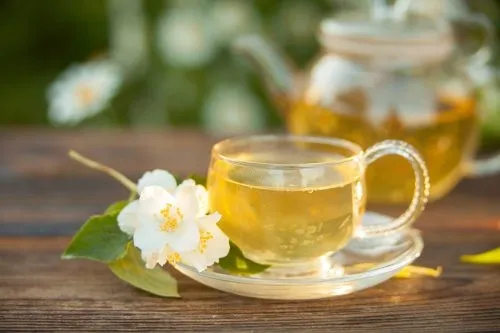 white tea in a beautiful glass bowl on a table