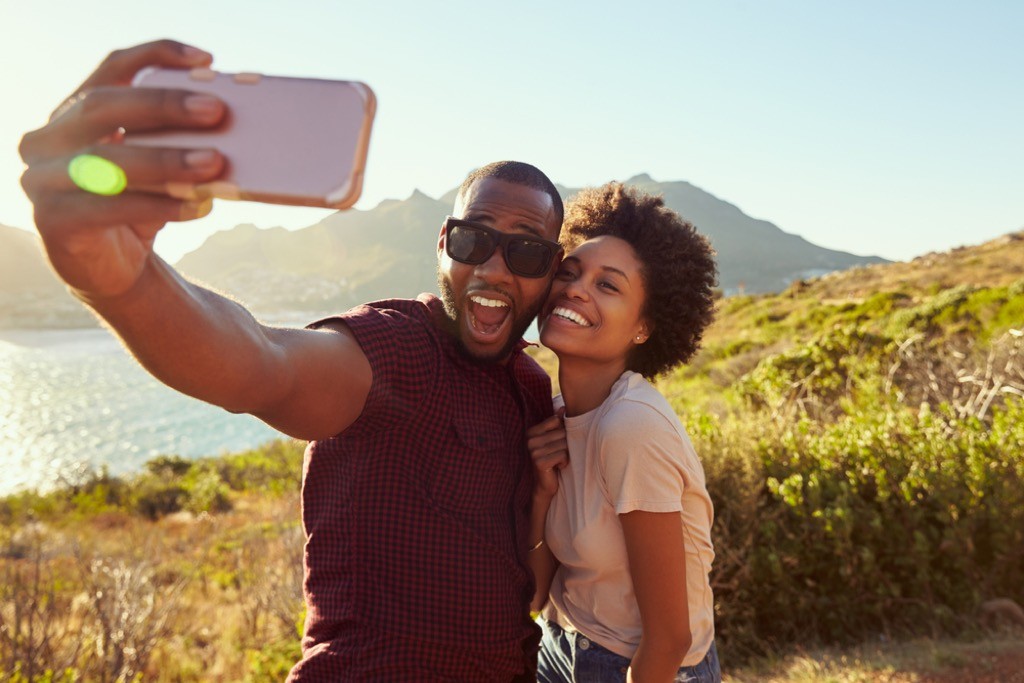 couple taking a selfie while hiking