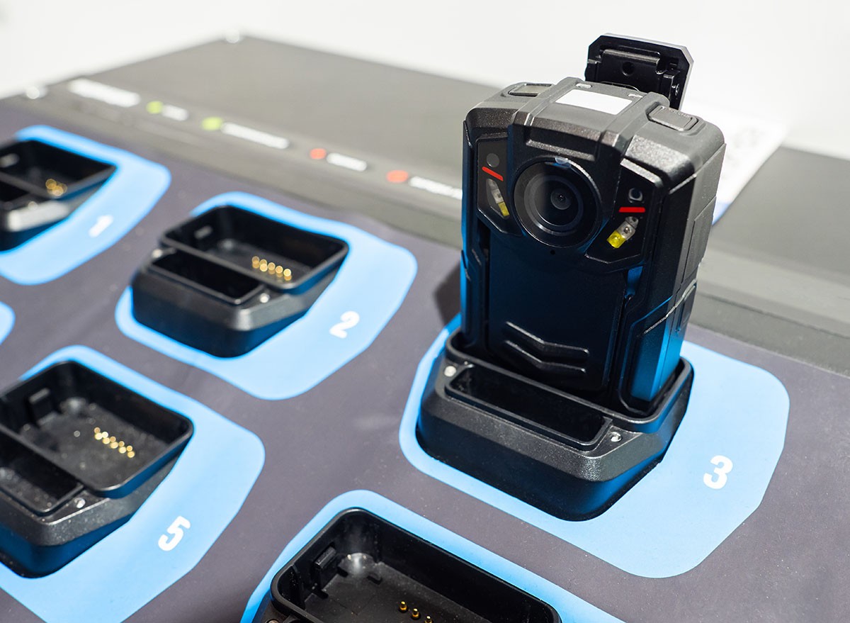 A body camera sitting on a charging station