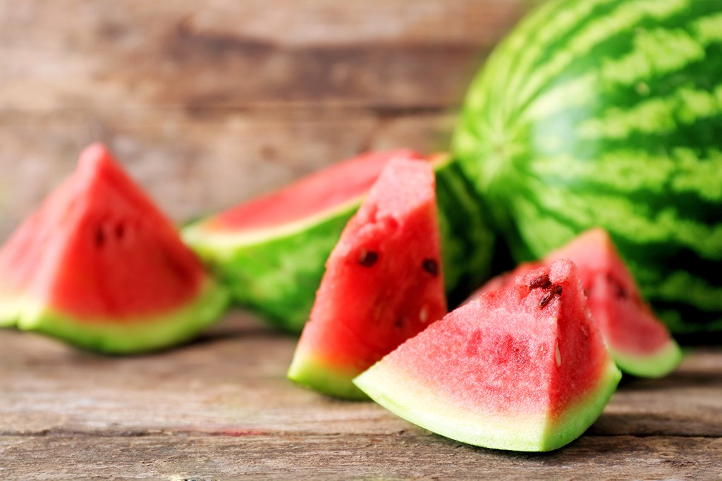 watermelon slices on a wooden table