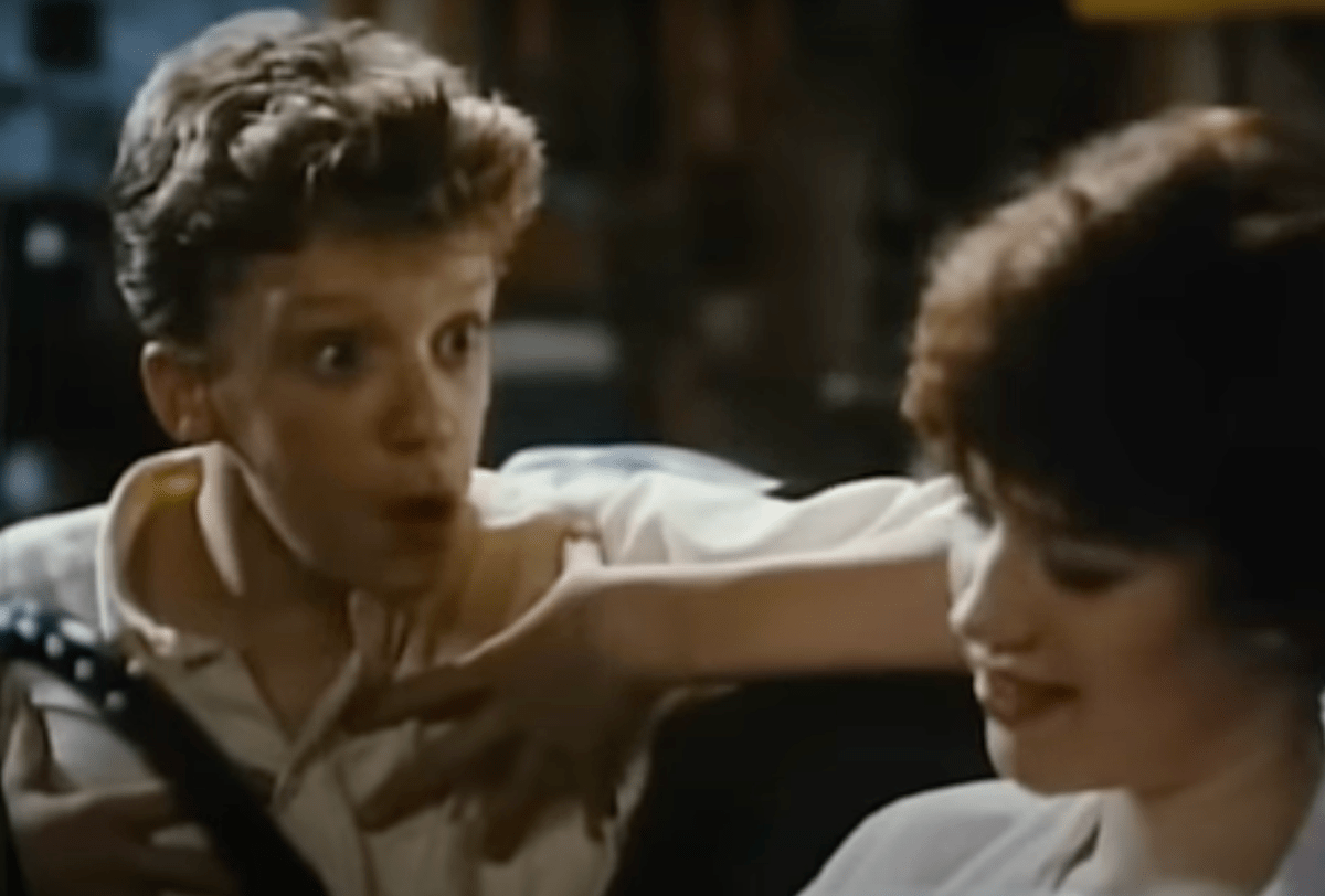still of Anthony Michael Hall and Molly Ringwald from "Sixteen Candles"
