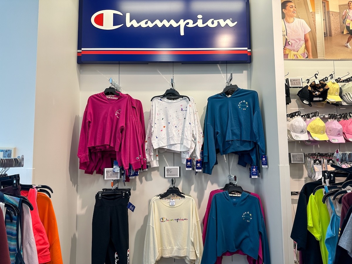 display of women's clothing in a Champion store