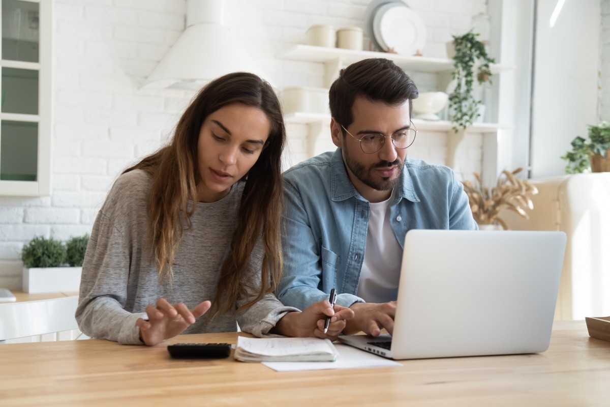 Couple stressed while working on their finances