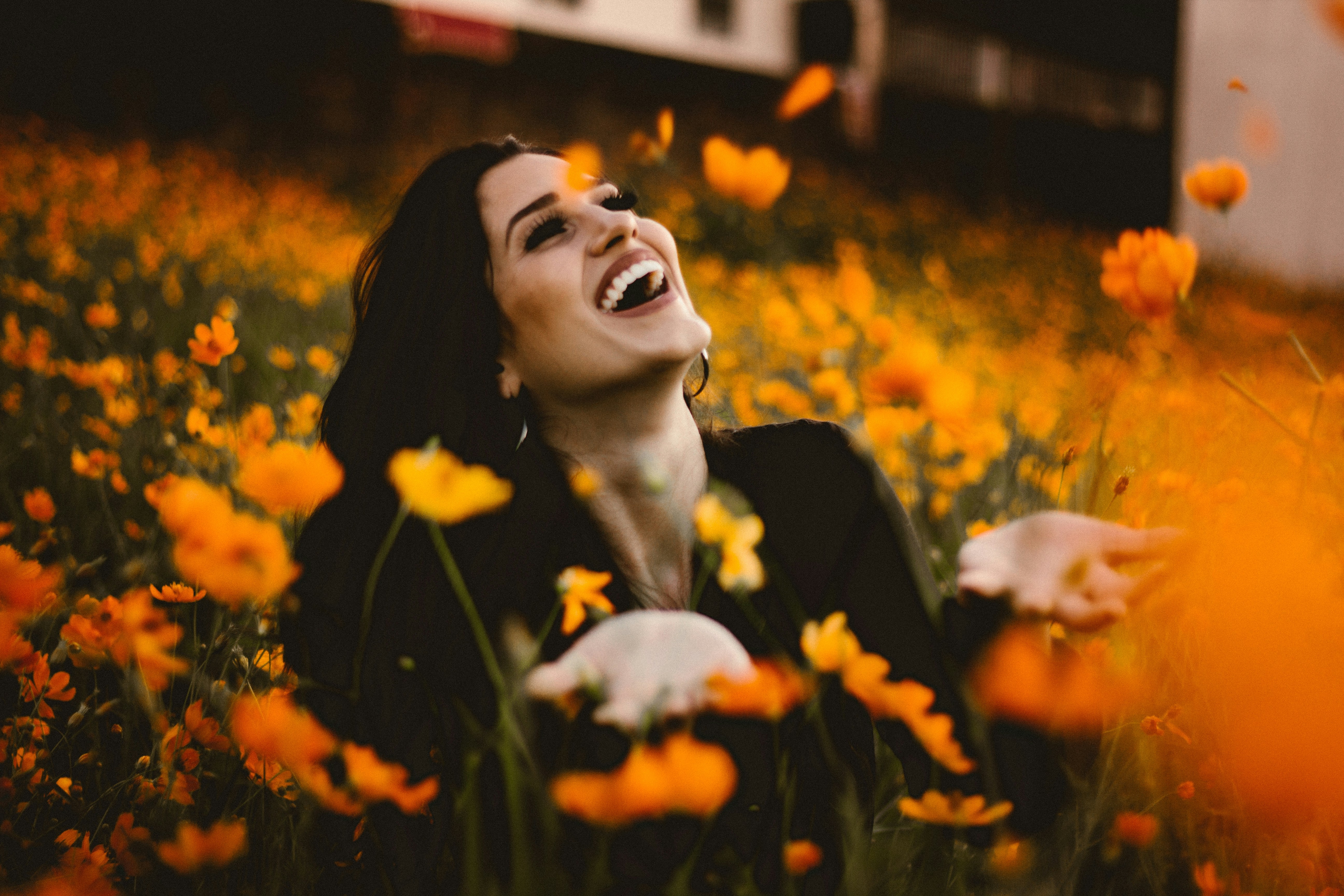 woman happily enjoys a walk in the field, restoring her emotional wellbeing and attentiveness