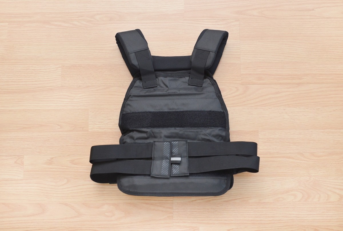 black weighted vest on a wood background