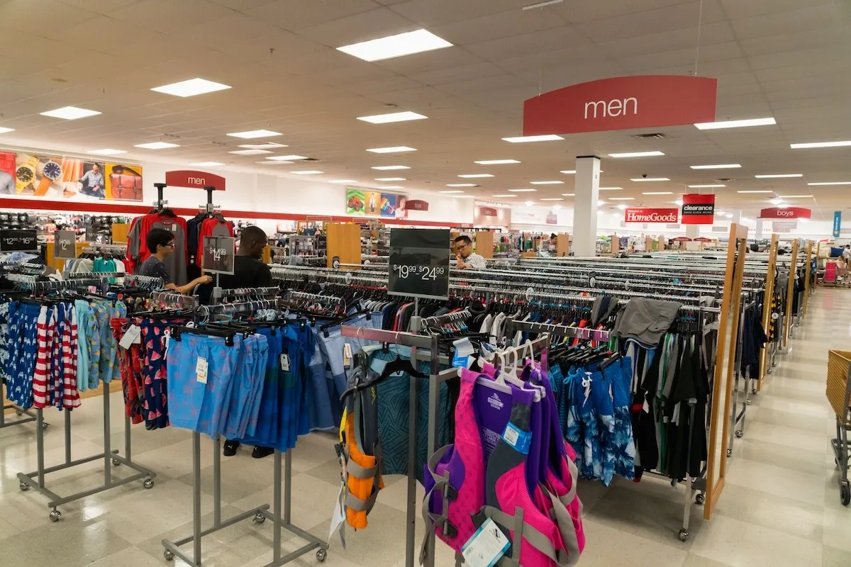 clothing racks in the men's section of a T.J. Maxx