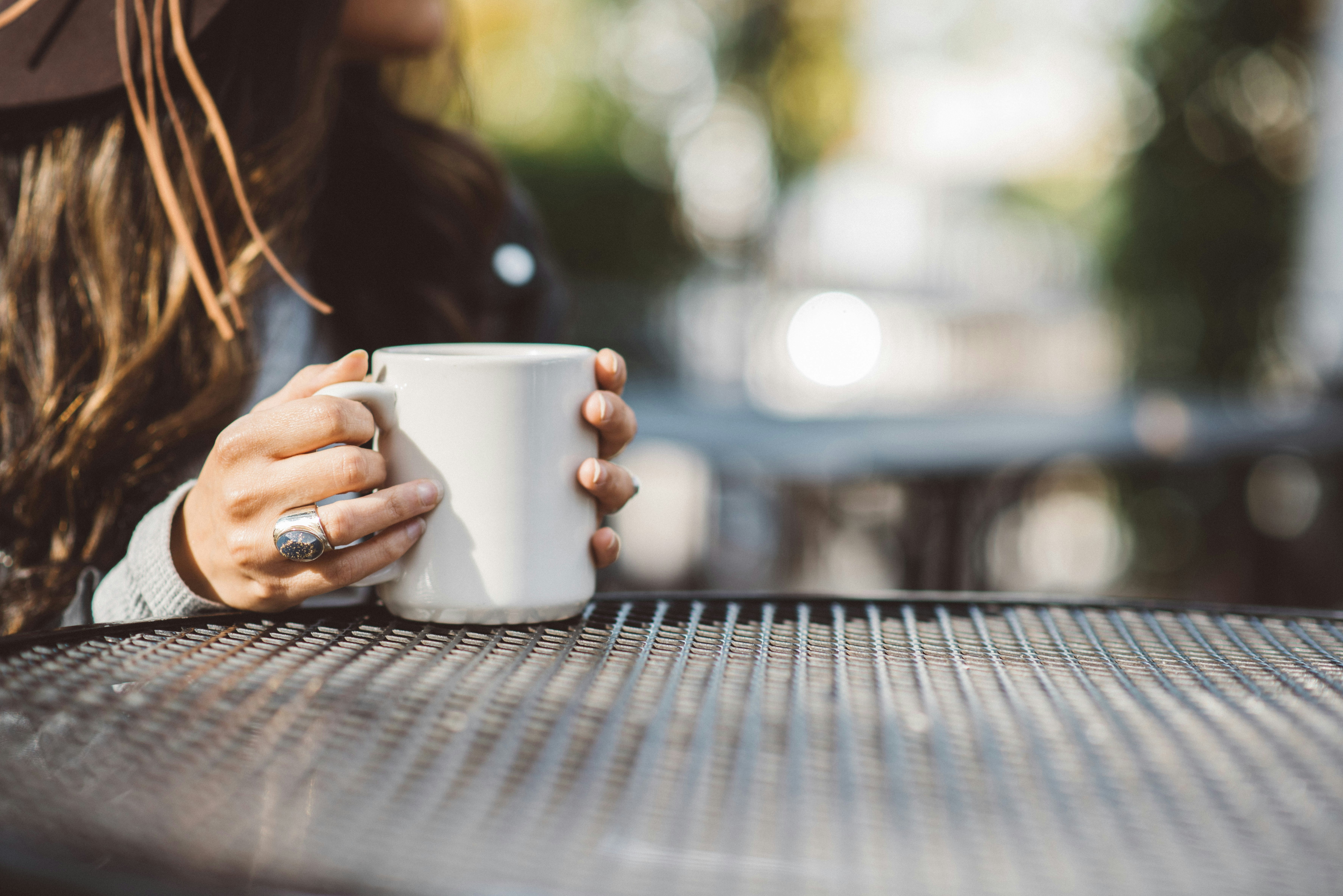 a woman takes a break with a coffee