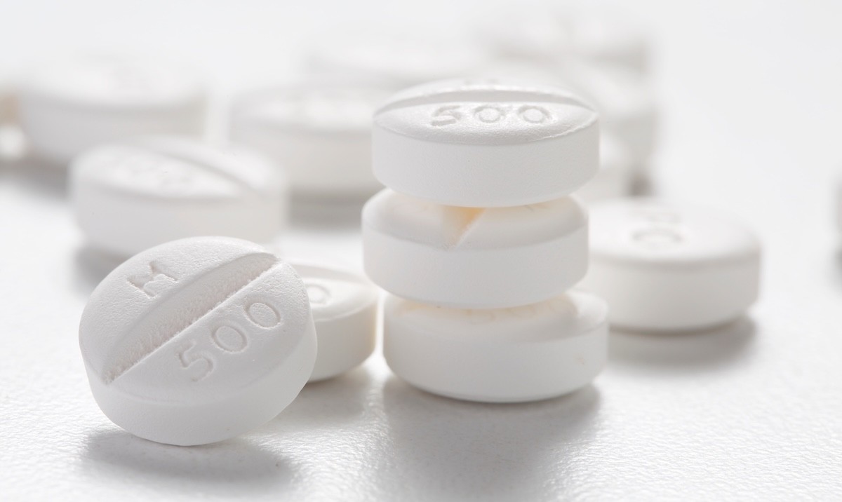 white metformin tablets on a white surface