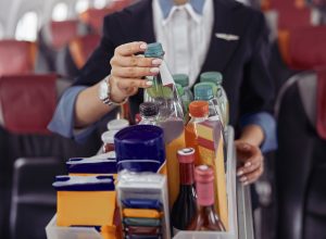 Flight Attendants Say Never Drink These 2 Beverages on a Plane—Here’s Why