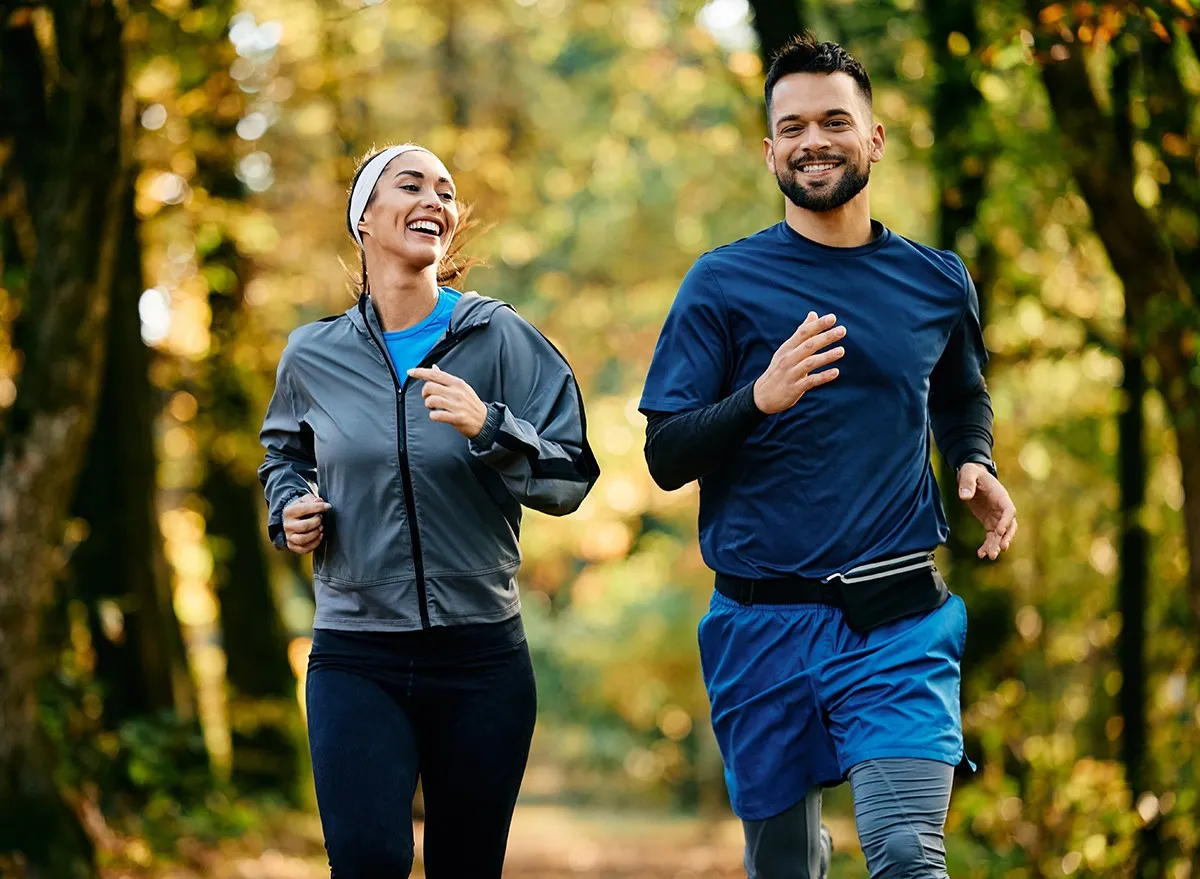A couple jogging together outside