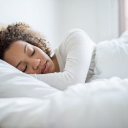 A woman sleeping in bed