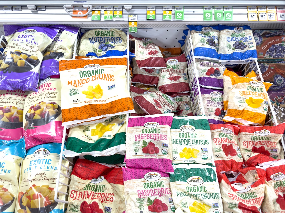 bags of frozen fruit at the grocery store
