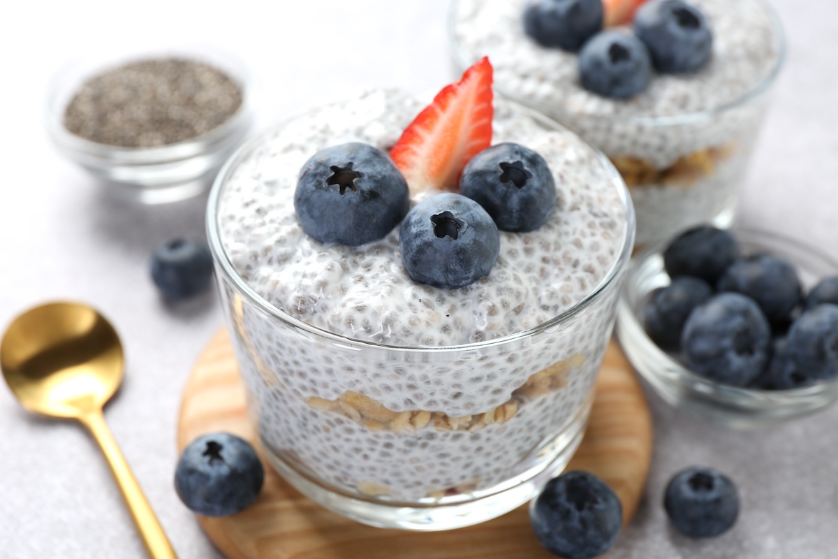 glass cups of yogurt, chia seeds, and blueberries