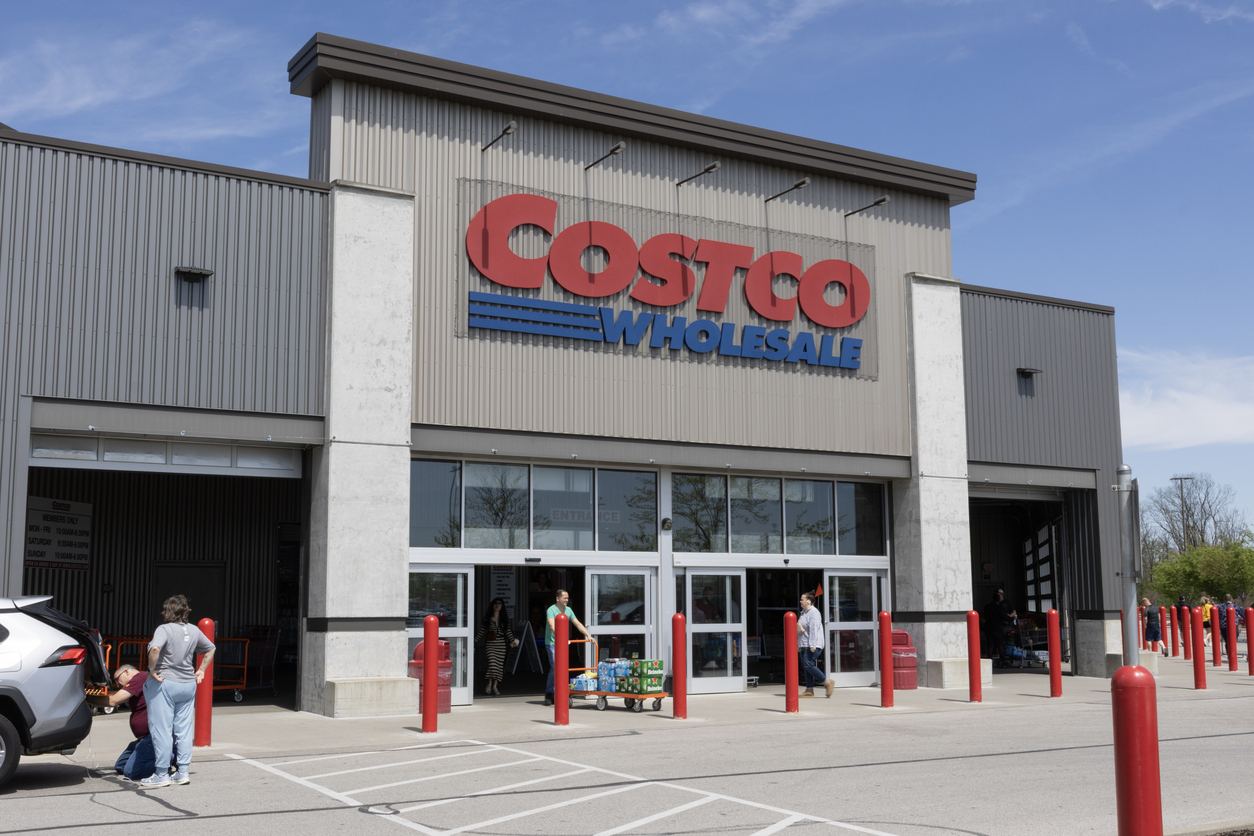 A Costco storefront with customers
