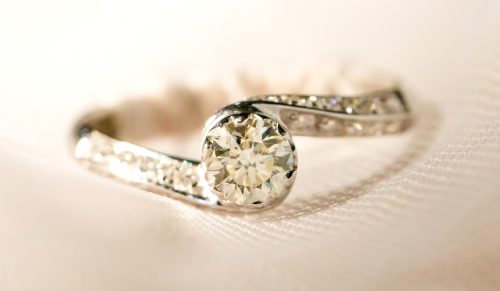 curbed bypass diamond engagement ring