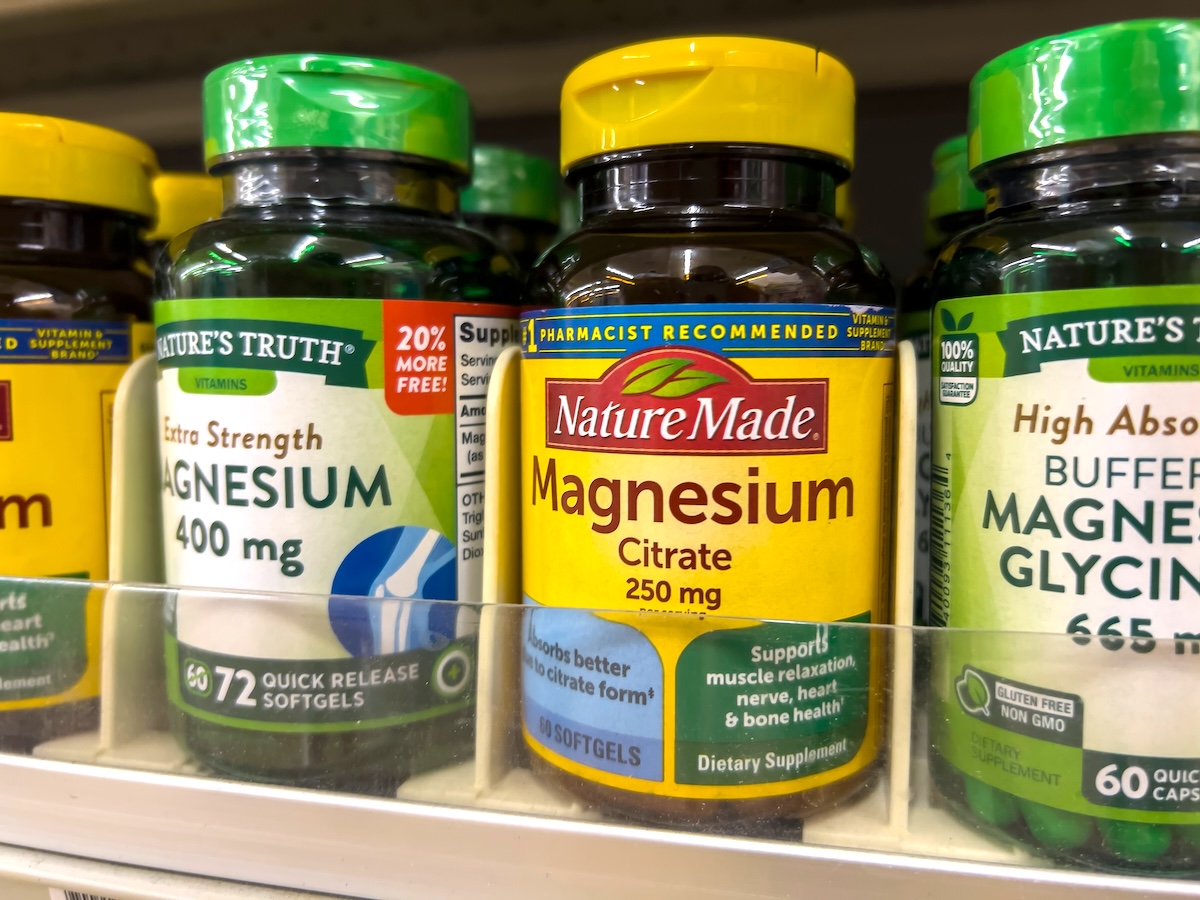 Bottles of magnesium supplements on a store shelf