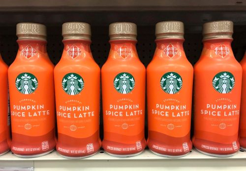Starbucks' pumpkin spice latte drinks on a shelf in the grocery store