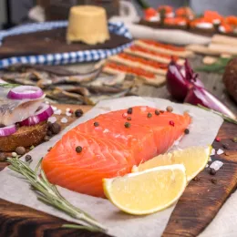traditional Norwegian cuisine, with a piece of salmon in the foreground