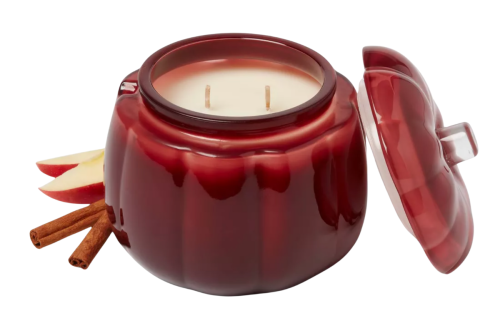 candle in a red glass apple jar