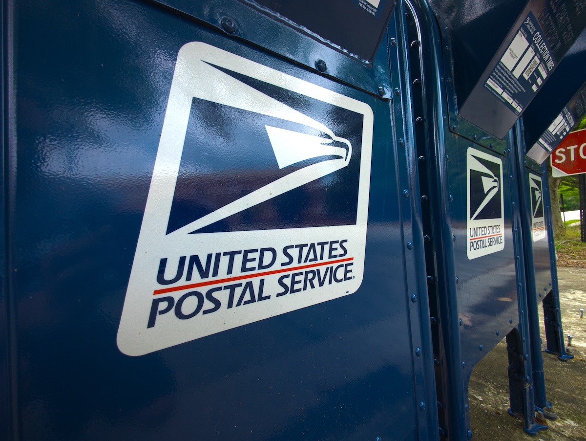closeup of USPS blue collection boxes