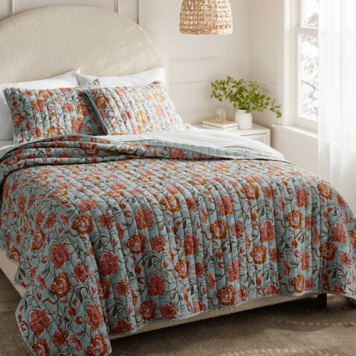 blue and pink floral quilt