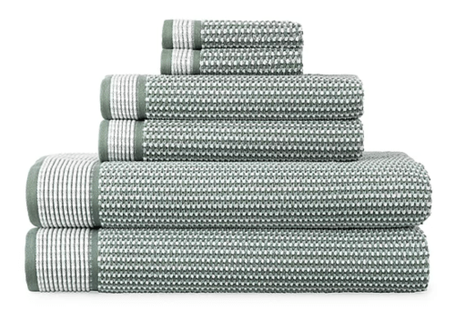 green textured towels in a stack