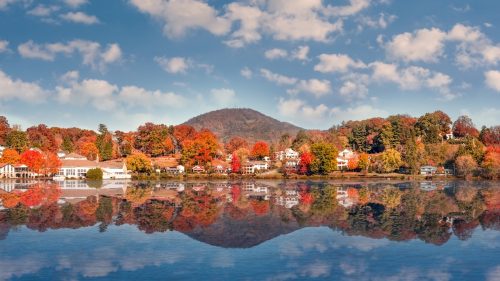 Fall Landscape showing Lake houses with reflections in Lake Junaluska in North Carolina