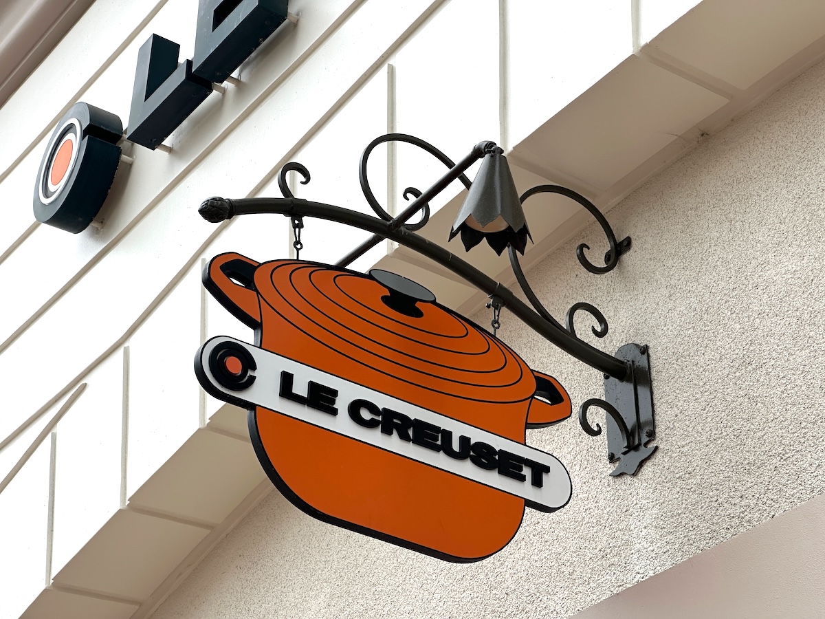 closeup of a sign on a Le Creuset store