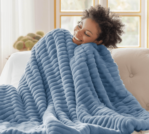woman cuddling in blue blanket