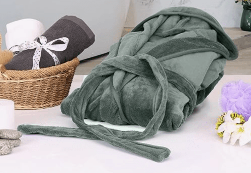 gray robe folded up in bathroom