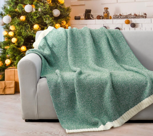 green blanket on a couch