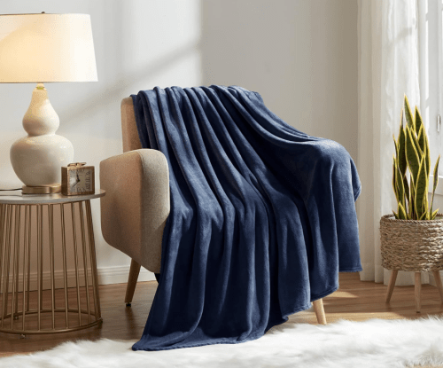 navy blue fleece throw blanket on a chair