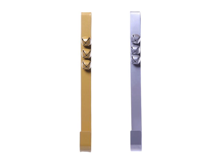 A gold and silver door hanger with bells