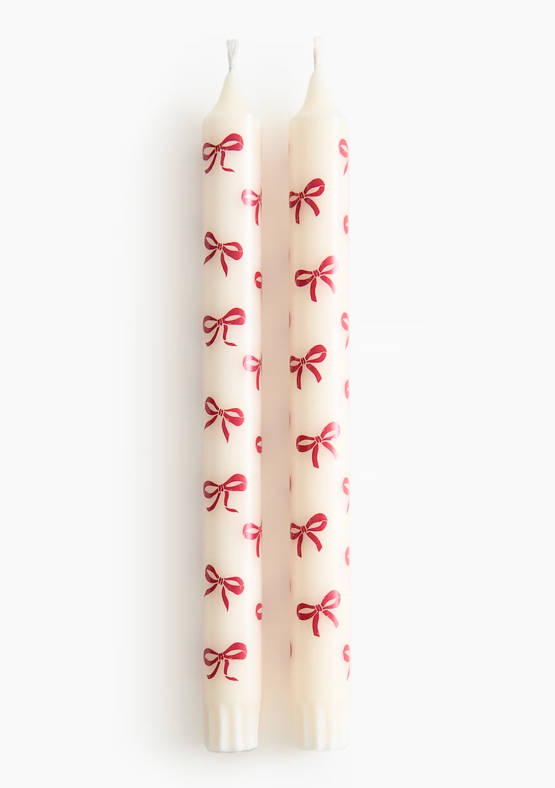 Candles decorated with imprinted red bows