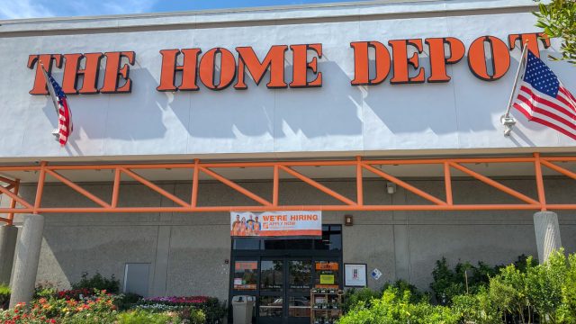 A Home Depot storefront with plants for sale