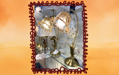 glass and gold flower lamp at HomeGoods