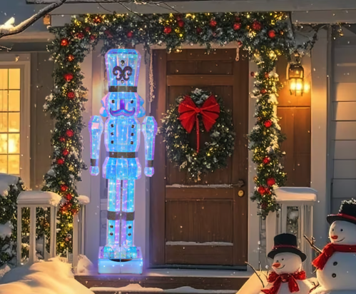 giant LED nutcracker on a porch of a house decorated for Christmas