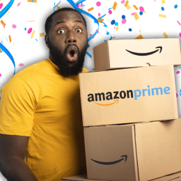 man in a yellow t-shirt holding amazon boxes, looking surprised, with a confetti background
