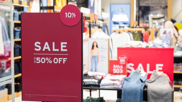 store with red sale signs