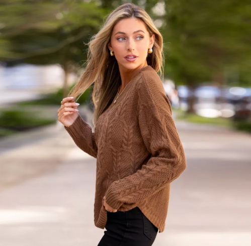 woman wearing a brown sweater