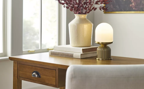 brass lamp on a table