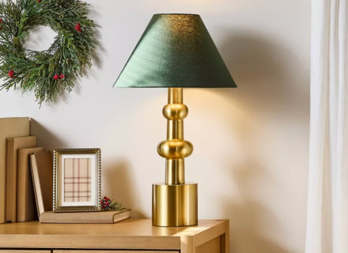 brass lamp on a table