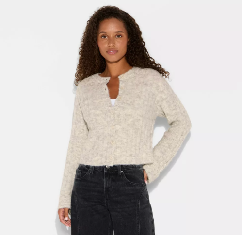 woman wearing a beige sweater