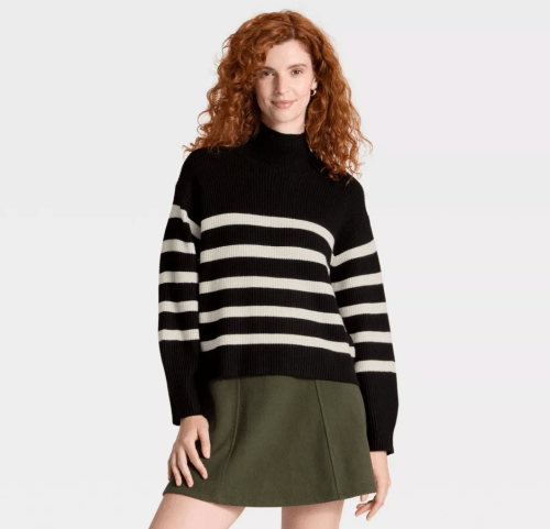 woman wearing a black and white sweater