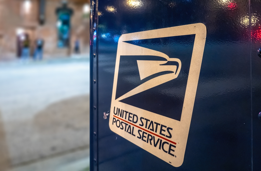 A close up of the USPS logo on a mailbox