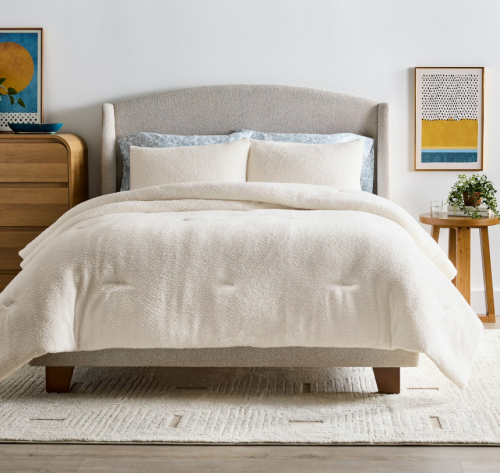 made made up with a cream colored duvet set