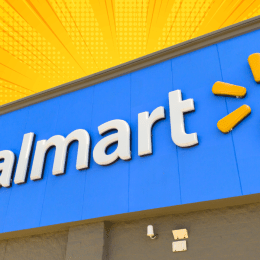walmart sign on a store with a yellow-orange background