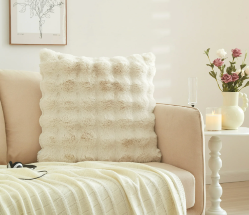 soft cream colored pillow on a couch