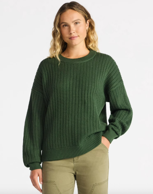 woman wearing a dark green sweater